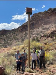 Volunteers and Abiquiu Lake park rangers stand next to a bat house they installed during the National Public Lands Day event at Abiquiu Lake, N.M., Sept. 25, 2021. A total of eight bat houses were installed during the event. Volunteers and Abiquiu Lake park rangers stand next to a bat house they installed during the National Public Lands Day event at Abiquiu Lake, N.M., Sept. 25, 2021. A total of eight bat houses were installed during the event.